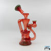 Curse Glass Full-Color Recycler Rig (Exp Red): Enhanced Filtration, Bold Design, Striking Red Glass Finish, Expert Craftsmanship, Superior Functionality, Recycler System, Smooth Filtered Hits, Compact and Durable, Perfectly Sized, Portability, Artisan Quality, High-End Glass Rig, Performance and Aesthetics.