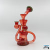Enhanced Filtration Recycler Rig: Curse Glass, Full-Color Design (Exp Red), Bold Design, Expert Craftsmanship, Superior Functionality, Smooth Filtered Hits, Compact and Durable, Perfectly Sized, Portability, Artisan Quality, High-End Glass Rig, Performance and Aesthetics.