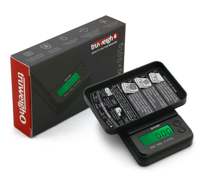 Truweigh Gauge Digital Mini Scale with 100g capacity and 0.01g accuracy, featuring a compact design, backlit LCD, tare function, and protective hard cover for precision weighing on the go.